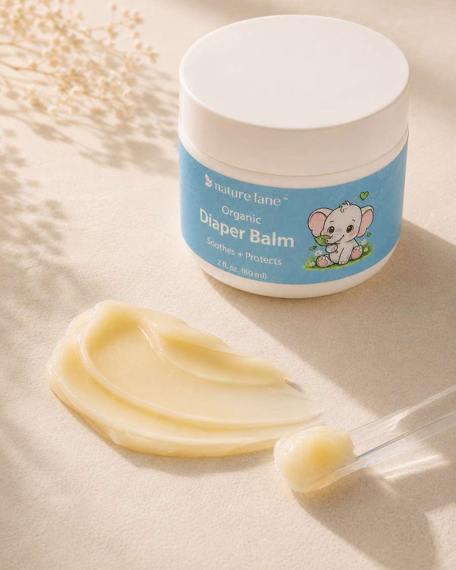 Rich balm texture beside Nature Lane Organic Diaper Balm jar